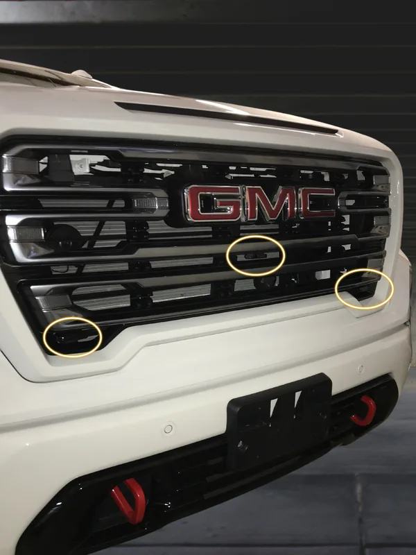 Front laser shifter transponders installed in the grille of a GMC Sierra by Xclusive Autosound, Belleville IL